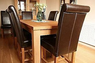 Tallinn Butterfly extending table and Titan Roll Back leather chairs