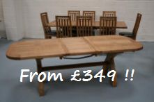 We have a limited number of the solid American oak chunky oval cross leg tables for sale a just 349 with a slight repair below the table top that means the extension needs a little help when aligining the pins to close the table.